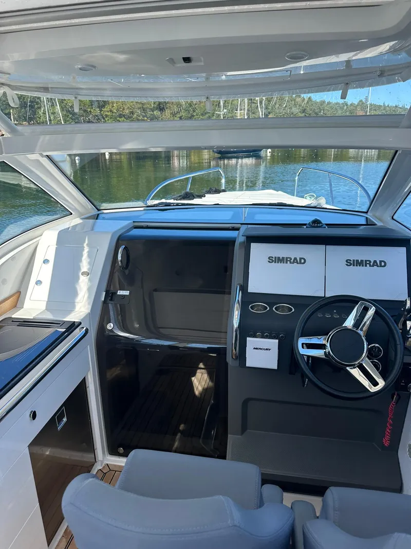 Slide: The Image of Interior of 2021 Nimbus W9 boat with Simrad navigation system. - 23