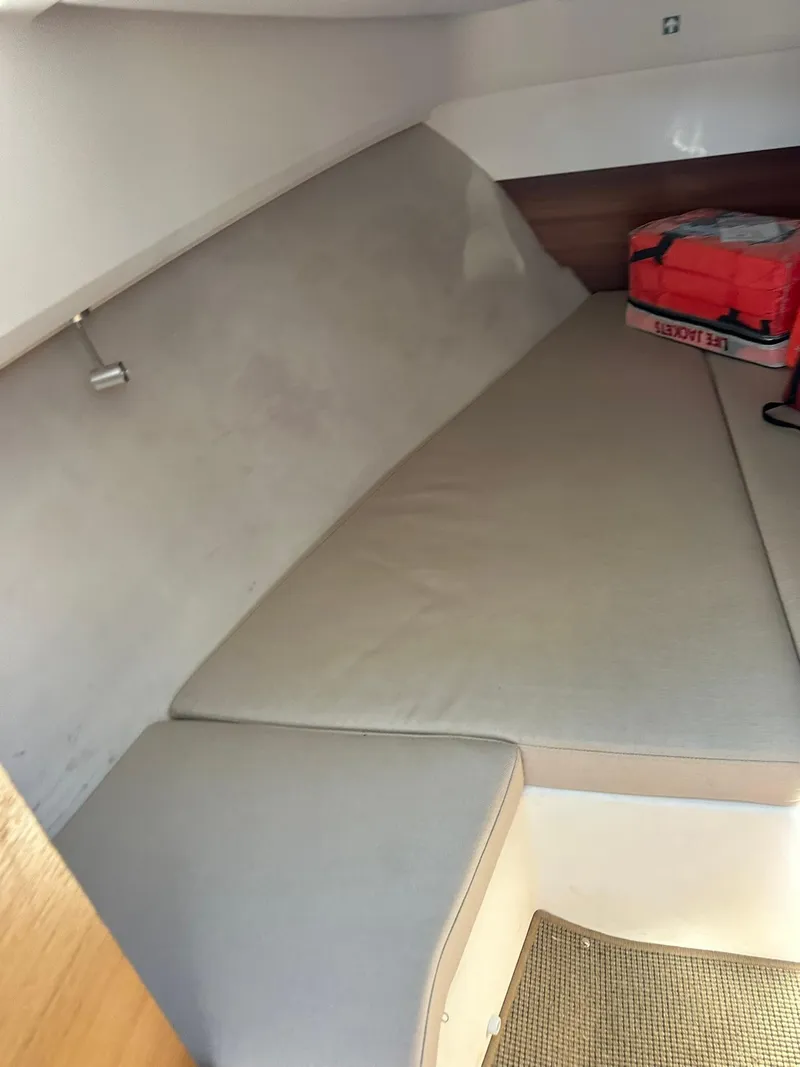Slide: The Image of Interior cabin of 2021 Nimbus W9 boat with cushioned seating. - 38