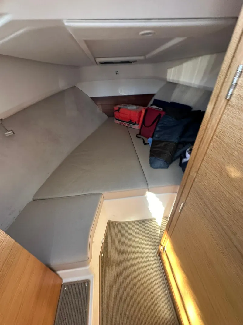 Slide: The Image of Cozy cabin interior of 2021 Nimbus W9 boat with seating and storage. - 46