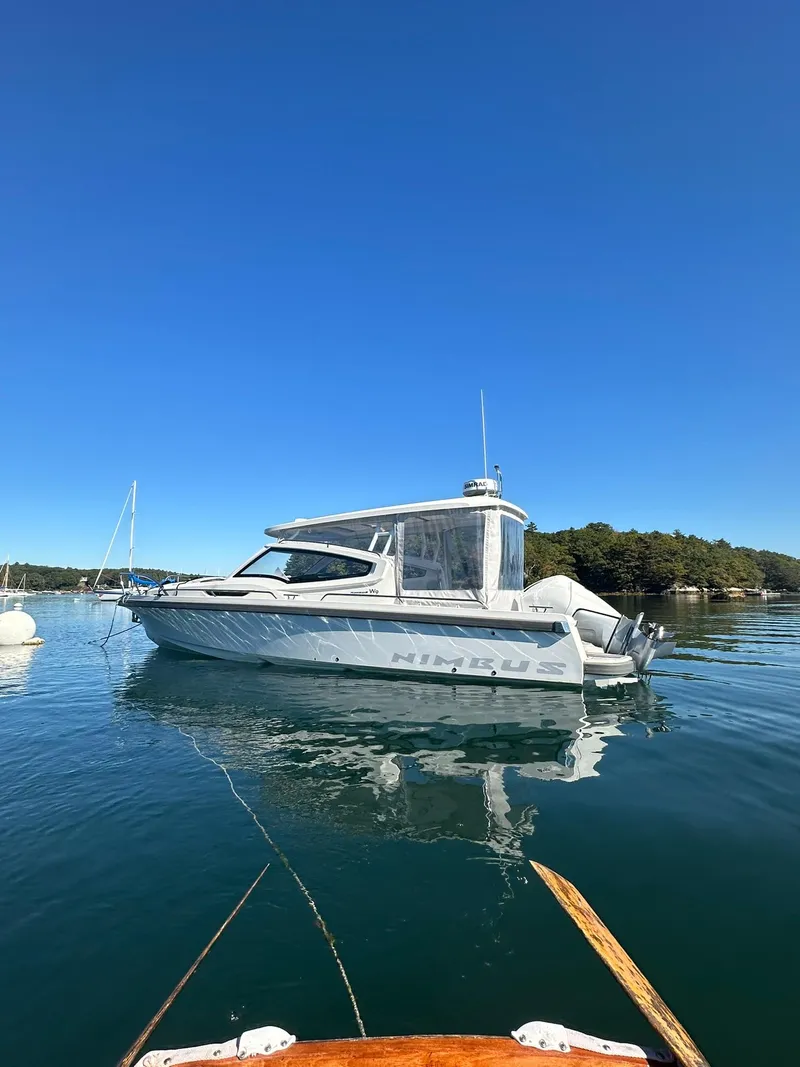 Slide: The Image of Nimbus W9 2021 boat on calm water under clear blue sky. - 5