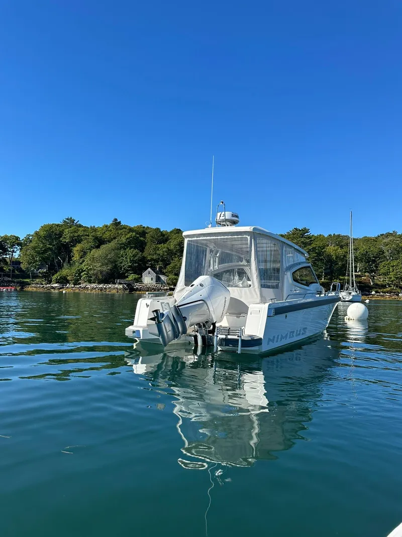 Slide: The Image of Nimbus W9 2021 boat on calm water with clear blue sky. - 7