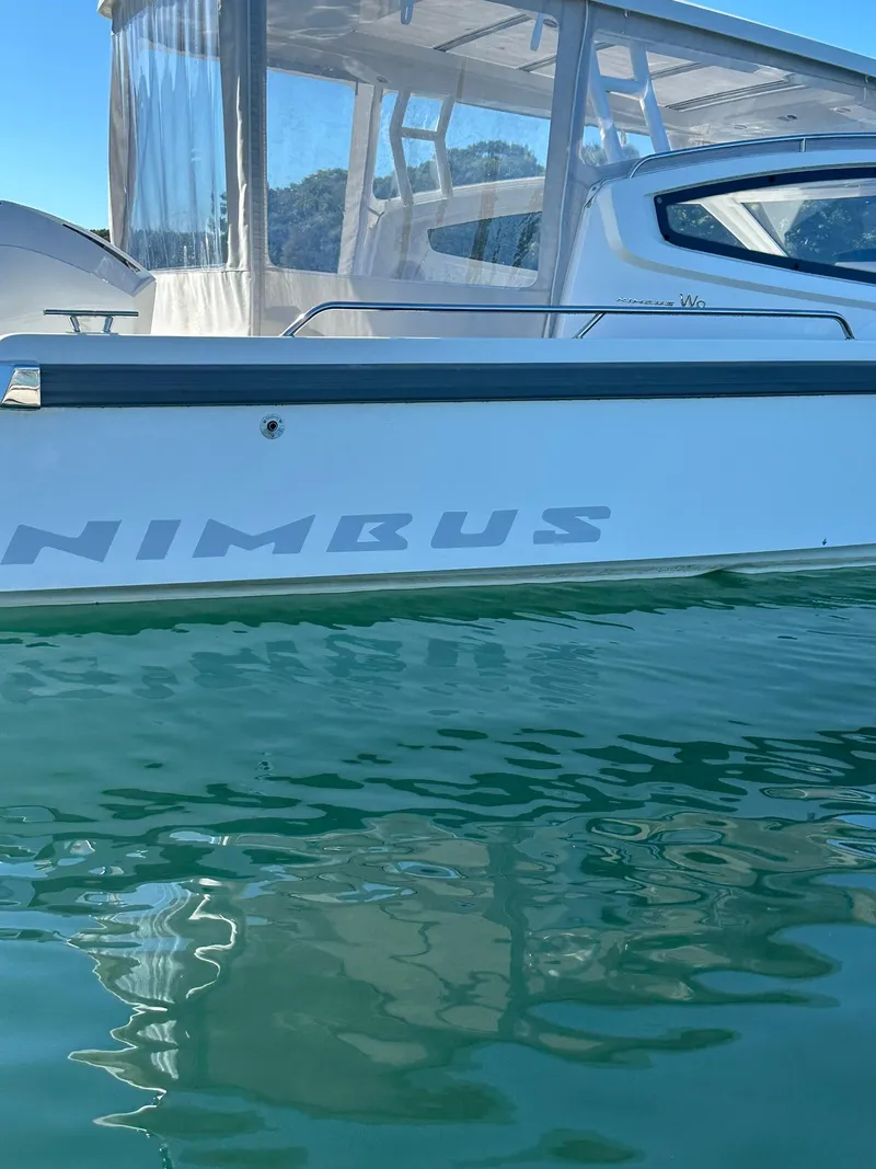 Slide: The Image of Nimbus W9 2021 boat on calm water, side view with clear sky. - 9