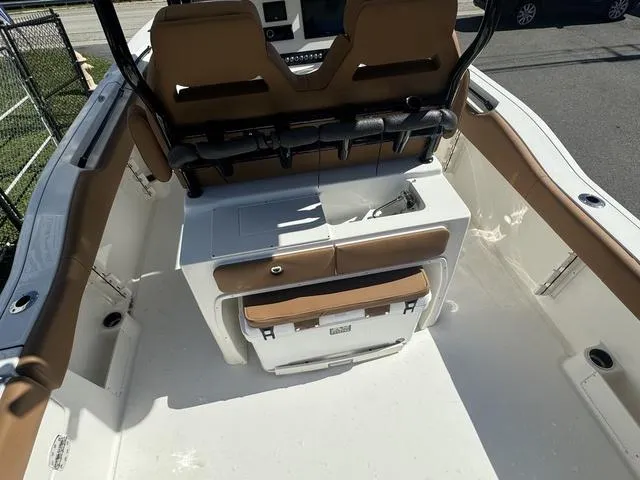Slide: The Image of 2025 Key West 263 FS boat interior with seating and storage compartments. - 12