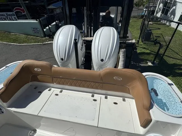 Slide: The Image of 2025 Key West 263 FS boat with twin engines and tan seating. - 13