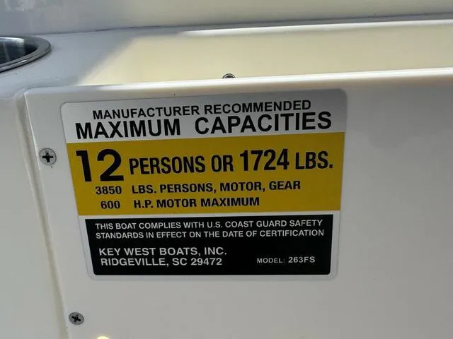 Slide: The Image of Key West 263 FS 2025 boat capacity label: 12 persons or 1724 lbs, 600 HP motor max. - 14