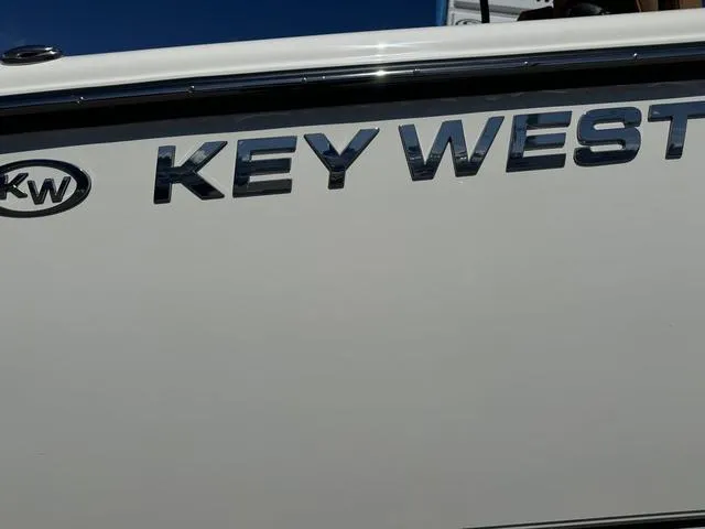 Slide: The Image of 2025 Key West 263 FS boat logo on white hull. - 7