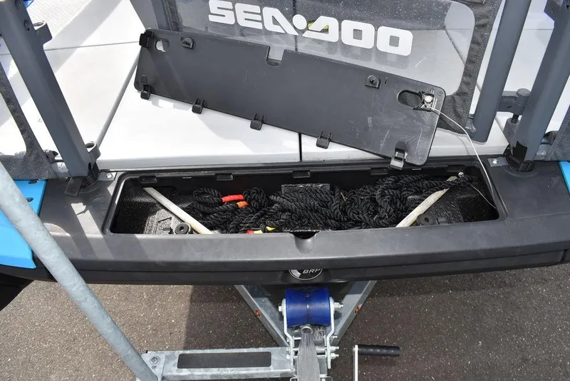 Slide: The Image of 2023 Sea-Doo Switch® Cruise 18-230 hp storage compartment with ropes and accessories. - 19