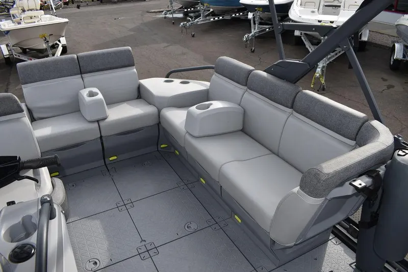 Slide: The Image of 2023 Sea-Doo Switch® Cruise 18-230 hp interior with gray seating and cup holders. - 22