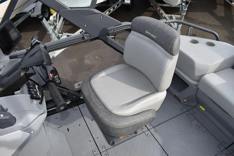 Slide: The Image of 2023 Sea-Doo Switch Cruise 18-230 hp interior with gray seating and controls. - 24
