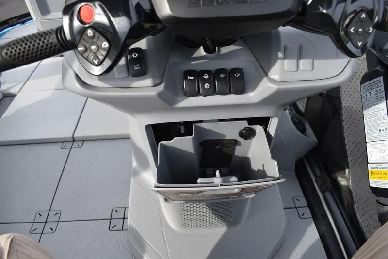 Slide: The Image of 2023 Sea-Doo Switch Cruise dashboard with controls and storage compartment. - 33
