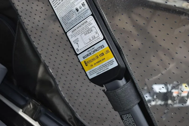 Slide: The Image of Capacity label on 2023 Sea-Doo Switch® Cruise 18-230 hp, indicating 8 persons or 1128 lbs. - 35