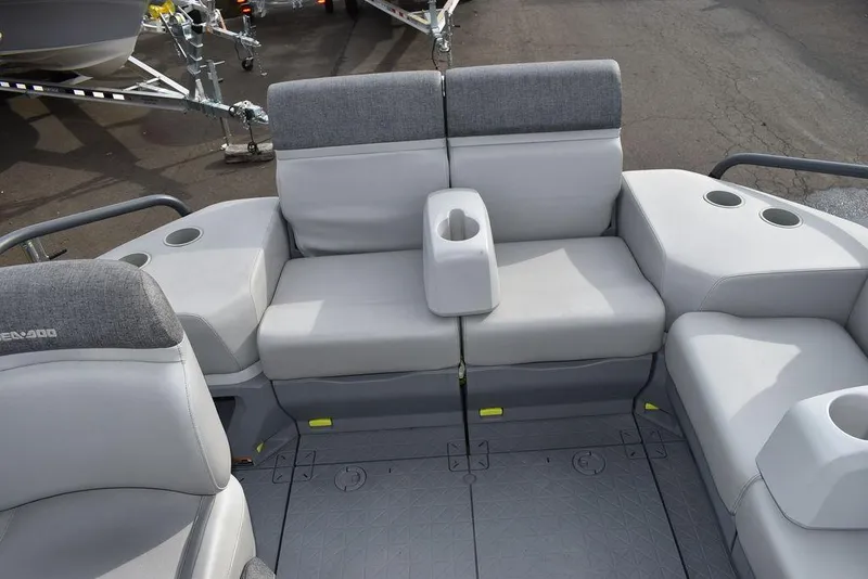 Slide: The Image of 2023 Sea-Doo Switch Cruise 18-230 hp boat interior with gray seating and cup holders. - 37