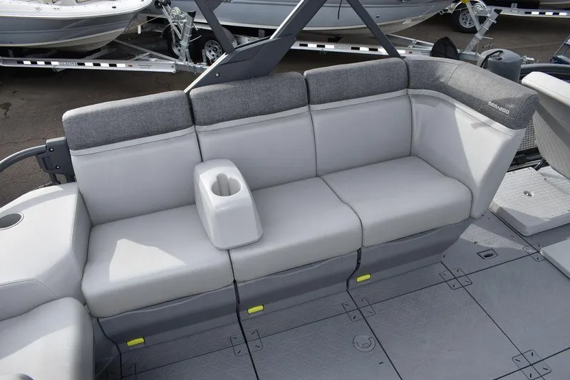 Slide: The Image of 2023 Sea-Doo Switch Cruise 18-230 hp boat seating with cup holder, gray upholstery. - 40