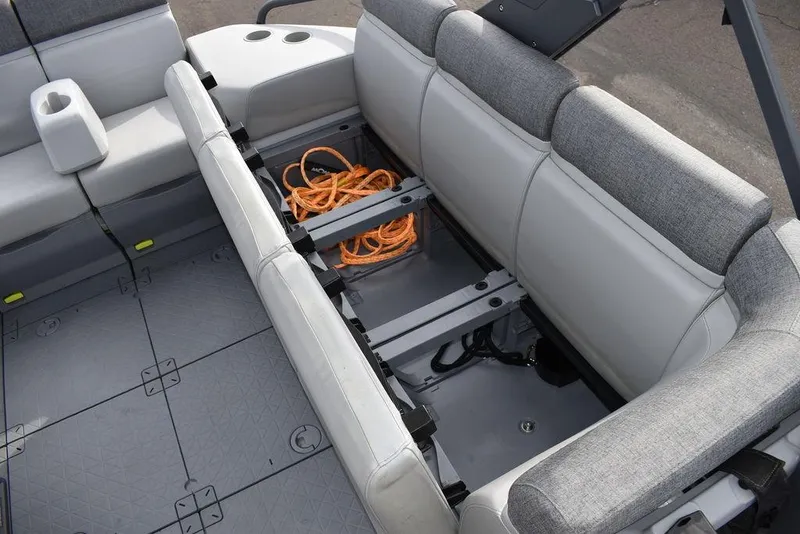 Slide: The Image of 2023 Sea-Doo Switch Cruise 18-230 hp interior storage with seating and orange rope. - 41