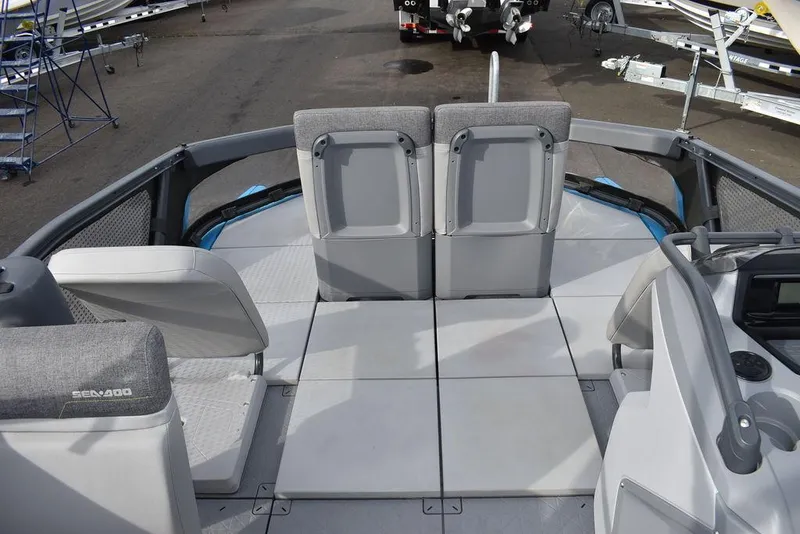 Slide: The Image of 2023 Sea-Doo Switch® Cruise 18-230 hp boat interior with gray seating and deck. - 42
