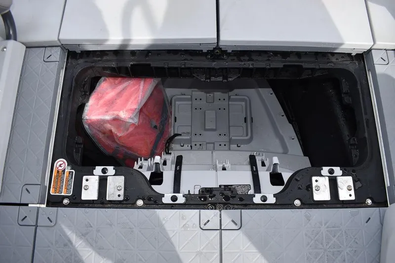 Slide: The Image of 2023 Sea-Doo Switch Cruise 18-230 hp storage compartment with red bag. - 48