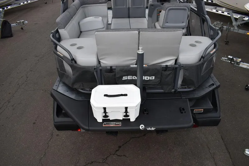 Slide: The Image of 2023 Sea-Doo Switch® Cruise 18-230 hp rear view with seating and storage. - 5
