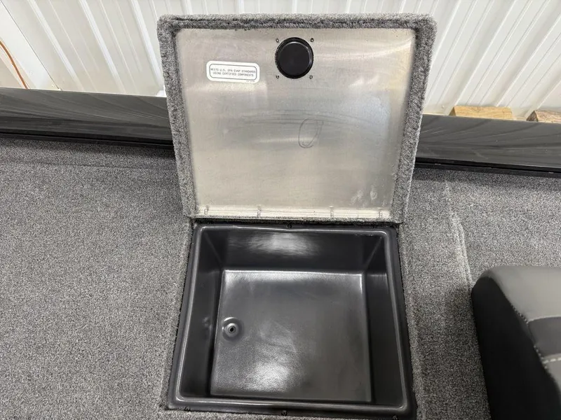 Slide: The Image of 2024 Tracker Pro Team™ 195 TXW Tournament Edition storage compartment with open lid, showcasing interior space. - 17