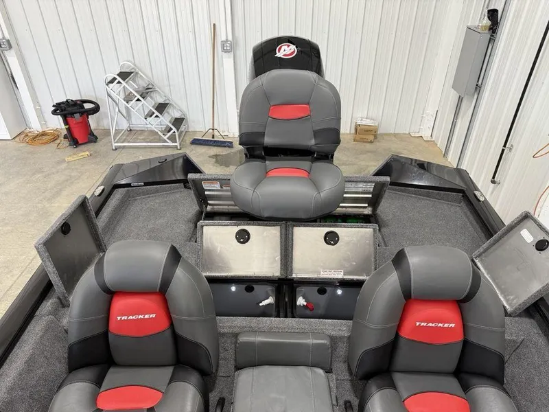 Slide: The Image of 2024 Tracker Pro Team™ 195 TXW Tournament Edition boat interior with gray and red seating. - 19