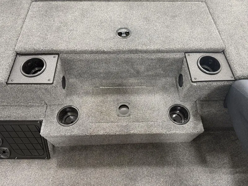 Slide: The Image of 2024 Tracker Pro Team™ 195 TXW Tournament Edition boat interior with cup holders and carpeted steps. - 20