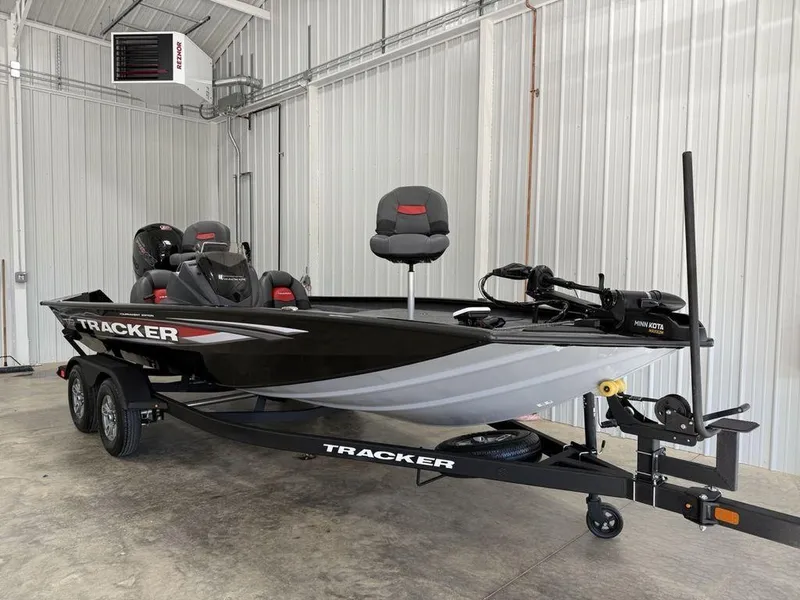 Slide: The Image of 2024 Tracker Pro Team™ 195 TXW Tournament Edition boat in a garage setting. - 3