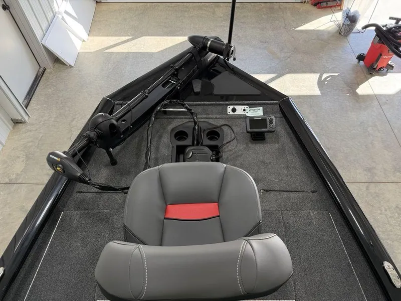 Slide: The Image of 2024 Tracker Pro Team™ 195 TXW Tournament Edition boat interior with fishing seat and equipment. - 4