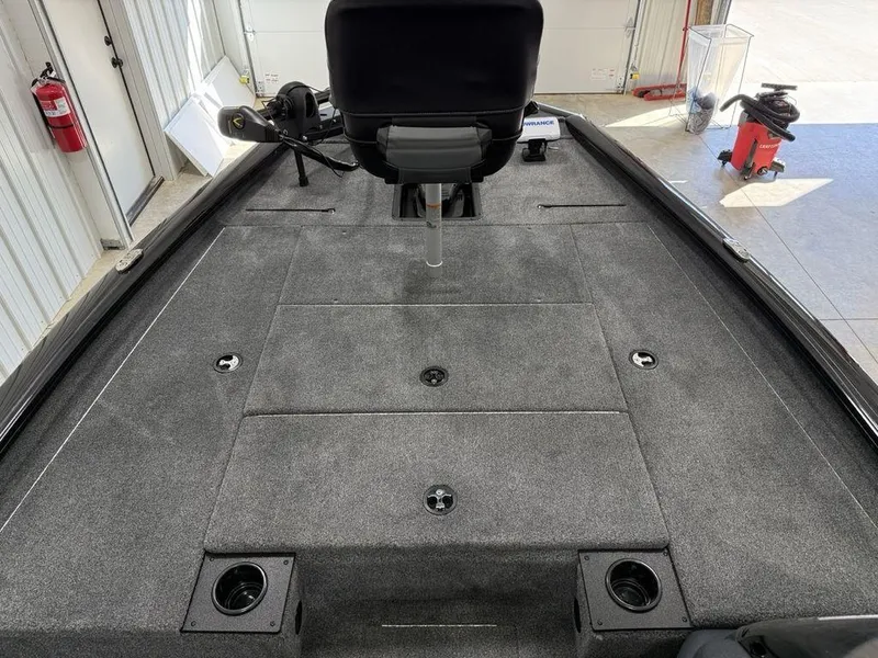 Slide: The Image of 2024 Tracker Pro Team™ 195 TXW Tournament Edition boat interior with carpeted deck and seating. - 8