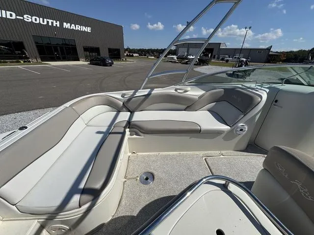Slide: The Image of 2002 Sea Ray 240 Sundeck boat interior with seating, parked at Mid-South Marine. - 6