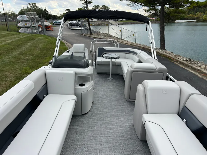 Slide: The Image of 2025 Godfrey Sweetwater 2286 C Special Edition pontoon boat with spacious seating and sleek design. - 11