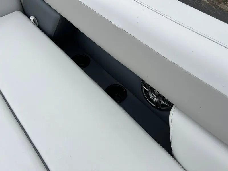 Slide: The Image of 2025 Godfrey Sweetwater 2286 C Special Edition boat interior with white seating and cup holders. - 12