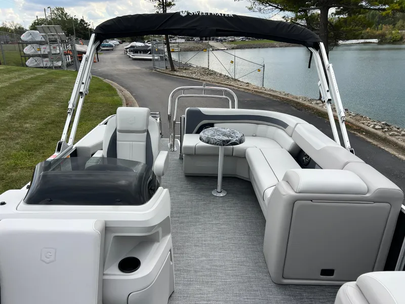 Slide: The Image of 2025 Godfrey Sweetwater 2286 C Special Edition pontoon boat with spacious seating and sleek design. - 13
