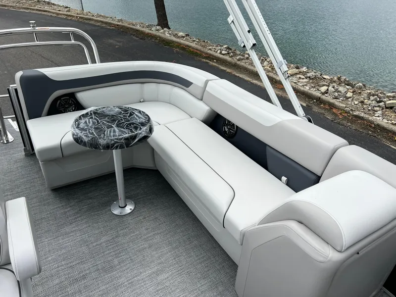 Slide: The Image of 2025 Godfrey Sweetwater 2286 C Special Edition pontoon boat with sleek seating and stylish table. - 15