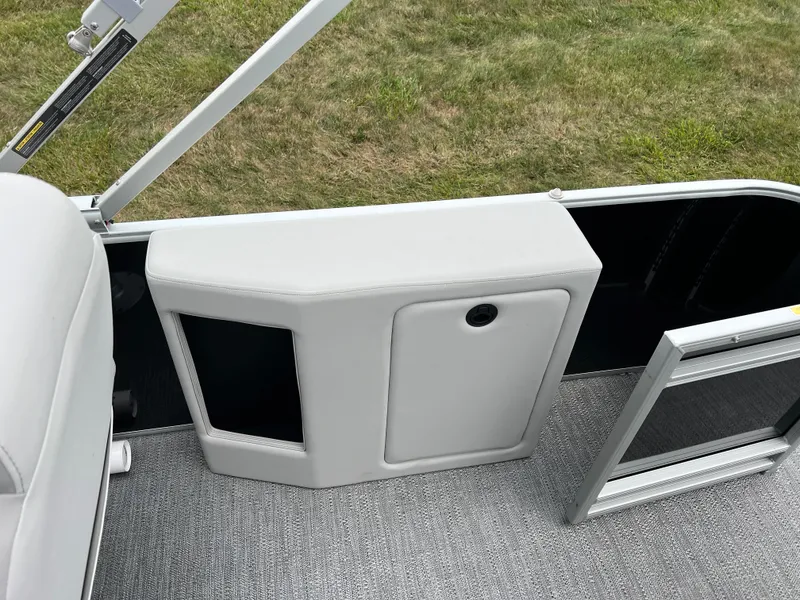 Slide: The Image of 2025 Godfrey Sweetwater 2286 C Special Edition boat interior with storage compartment. - 16