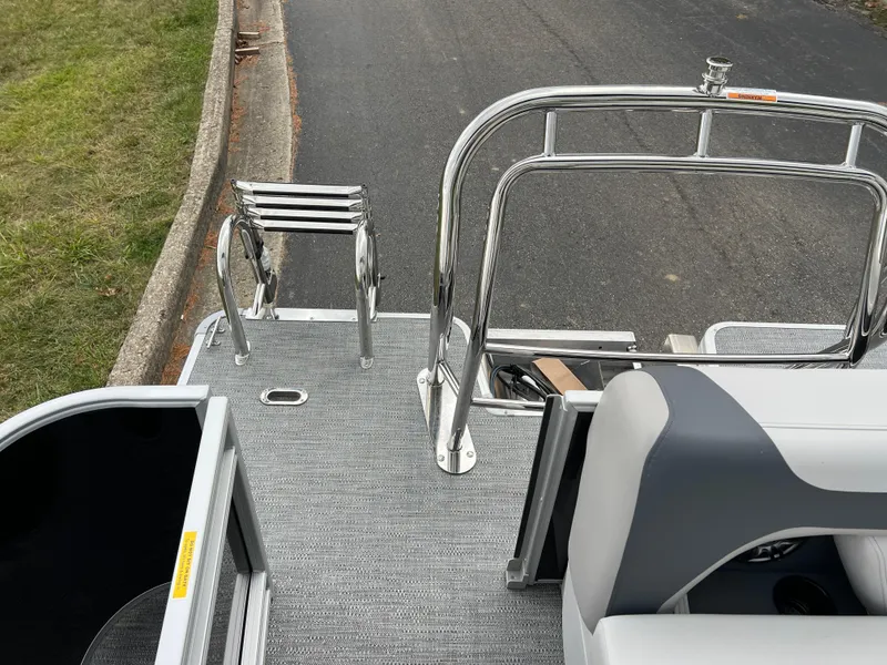 Slide: The Image of 2025 Godfrey Sweetwater 2286 C Special Edition boat deck with seating and railing. - 17