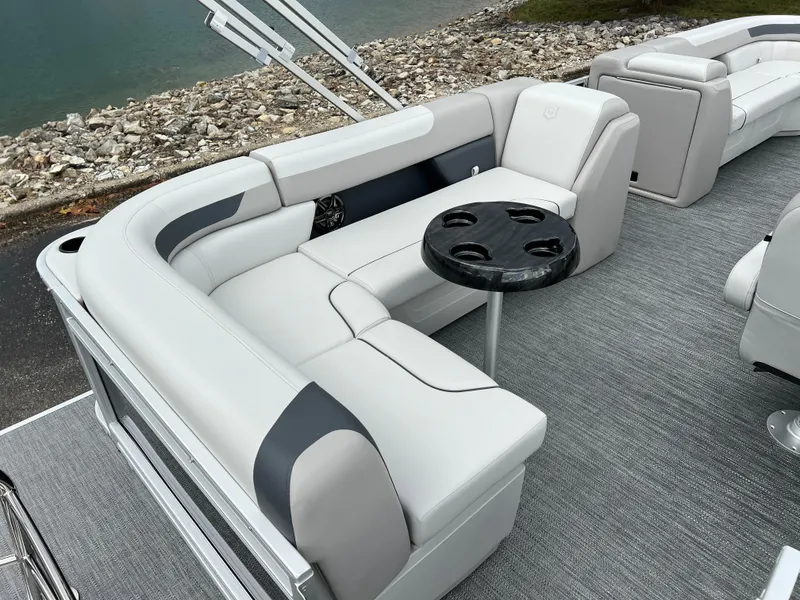 Slide: The Image of 2025 Godfrey Sweetwater 2286 C Special Edition boat interior with gray seating and cup holders. - 19