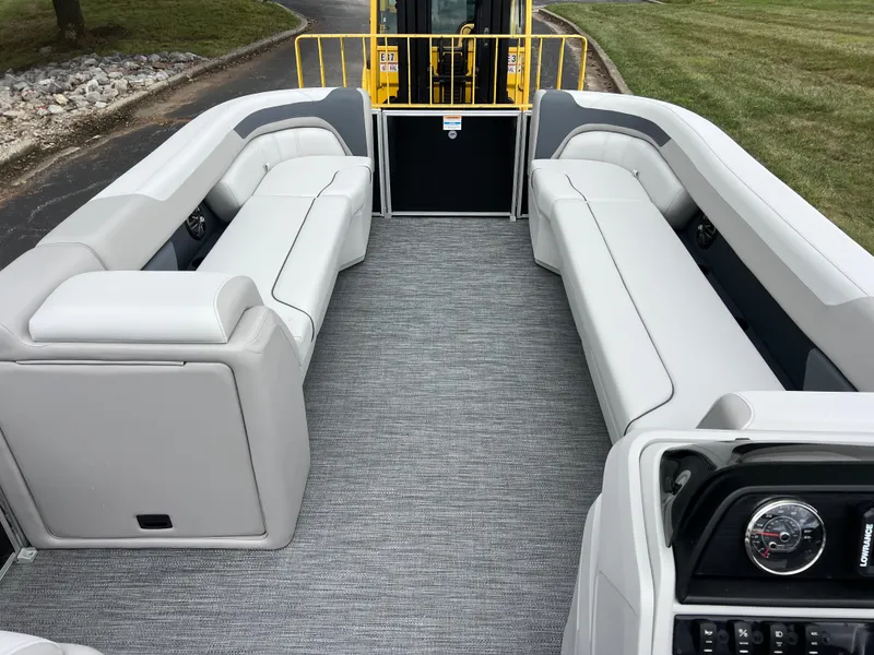 Slide: The Image of 2025 Godfrey Sweetwater 2286 C Special Edition pontoon boat interior with gray seating and carpet. - 26