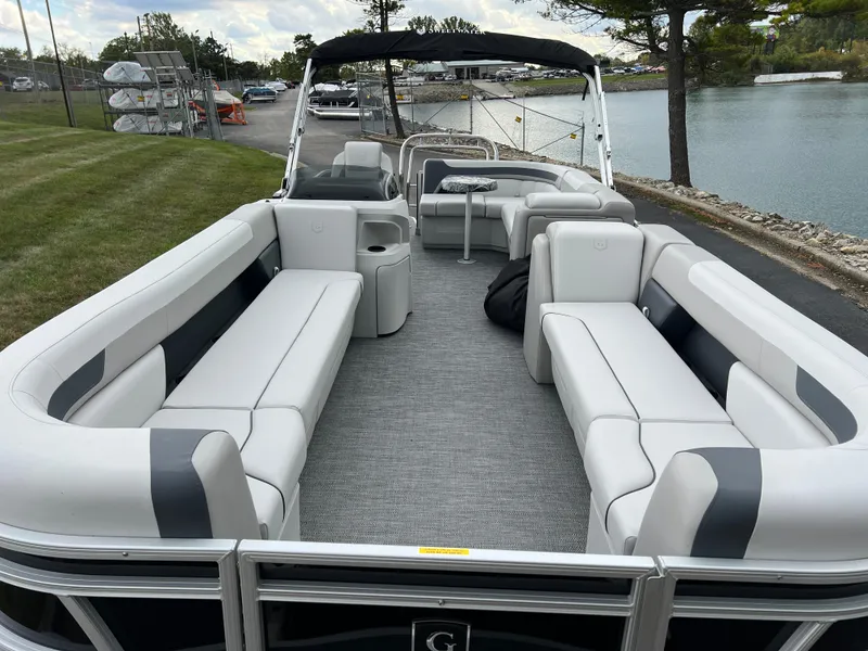 Slide: The Image of 2025 Godfrey Sweetwater 2286 C Special Edition pontoon boat with spacious seating and sleek design. - 8