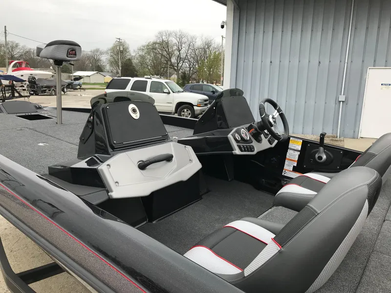 Slide: The Image of 2025 Ranger Z185 boat interior with dual seats and steering console. - 11