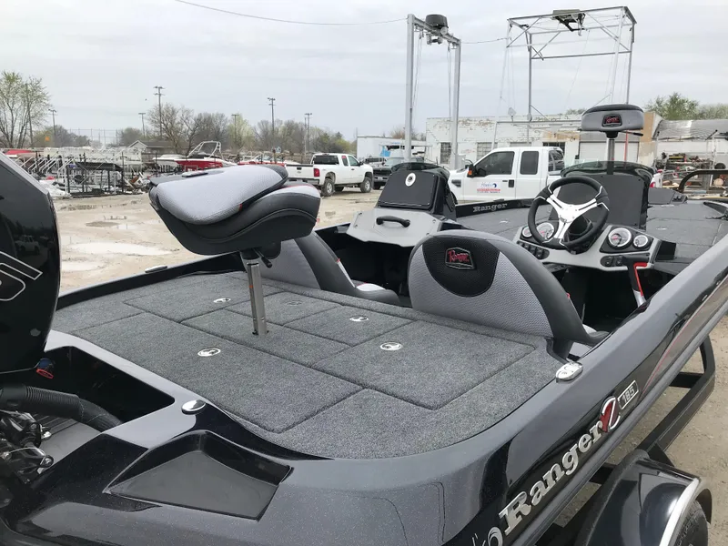 Slide: The Image of 2025 Ranger Z185 boat with Mercury Pro engine, featuring a spacious rear deck and seating. - 13