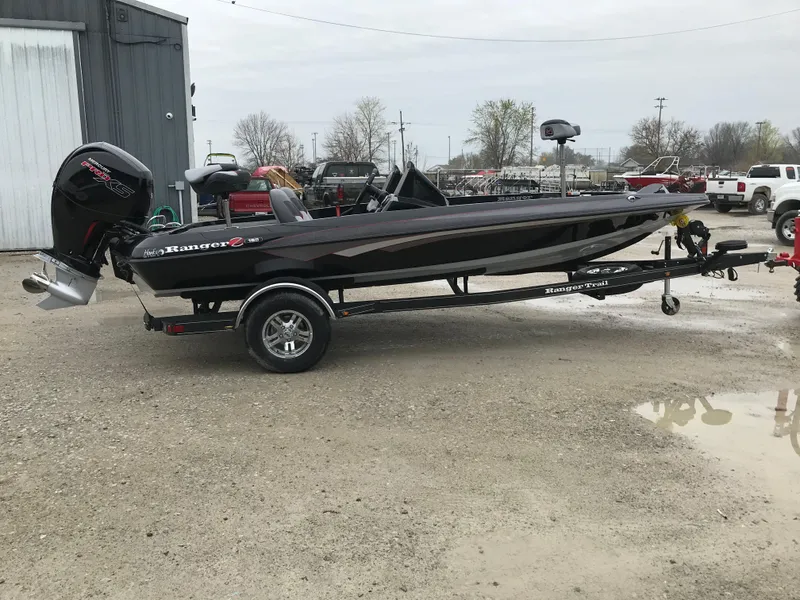 Slide: The Image of 2025 Ranger Z185 boat with powerful outboard motor in a parking lot. - 5