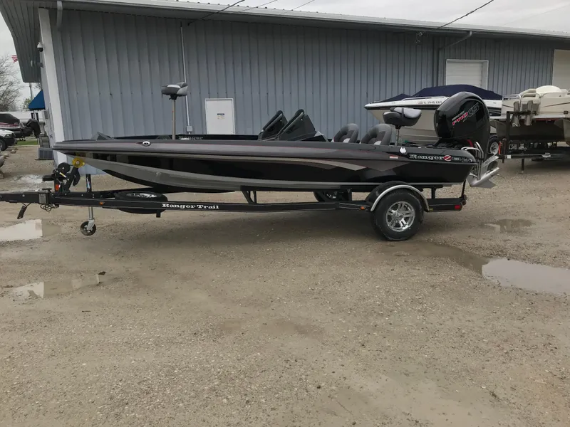 Slide: The Image of 2025 Ranger Z185 boat on trailer, parked outdoors near a building. - 6