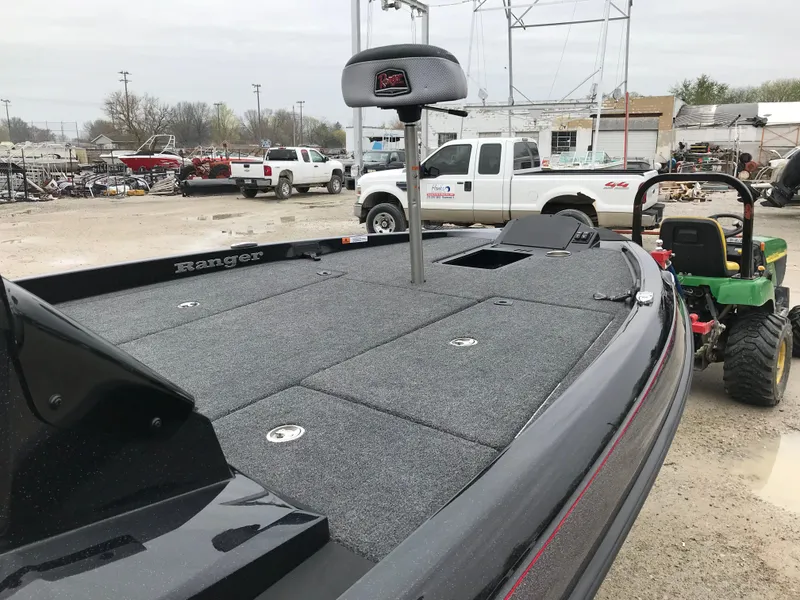 Slide: The Image of 2025 Ranger Z185 boat on trailer, parked outdoors near a building. - 7