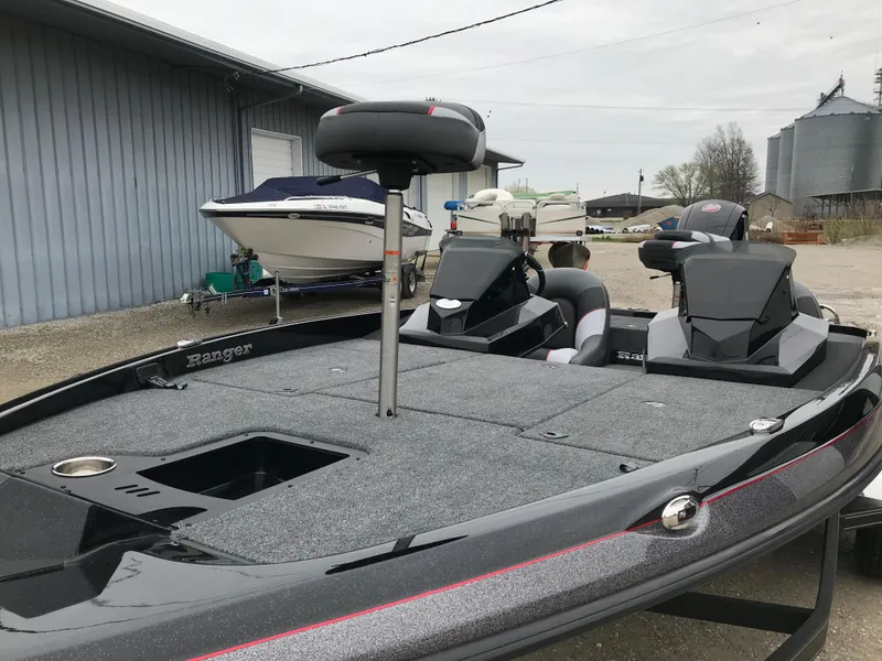 Slide: The Image of 2025 Ranger Z185 boat parked near industrial buildings and silos. - 9