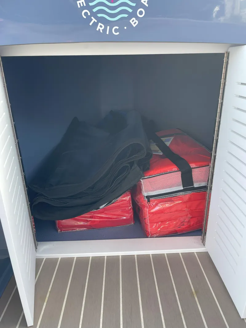 Slide: The Image of Storage compartment in 2024 Vision Marine Technologies Fantail 217 electric boat. - 13
