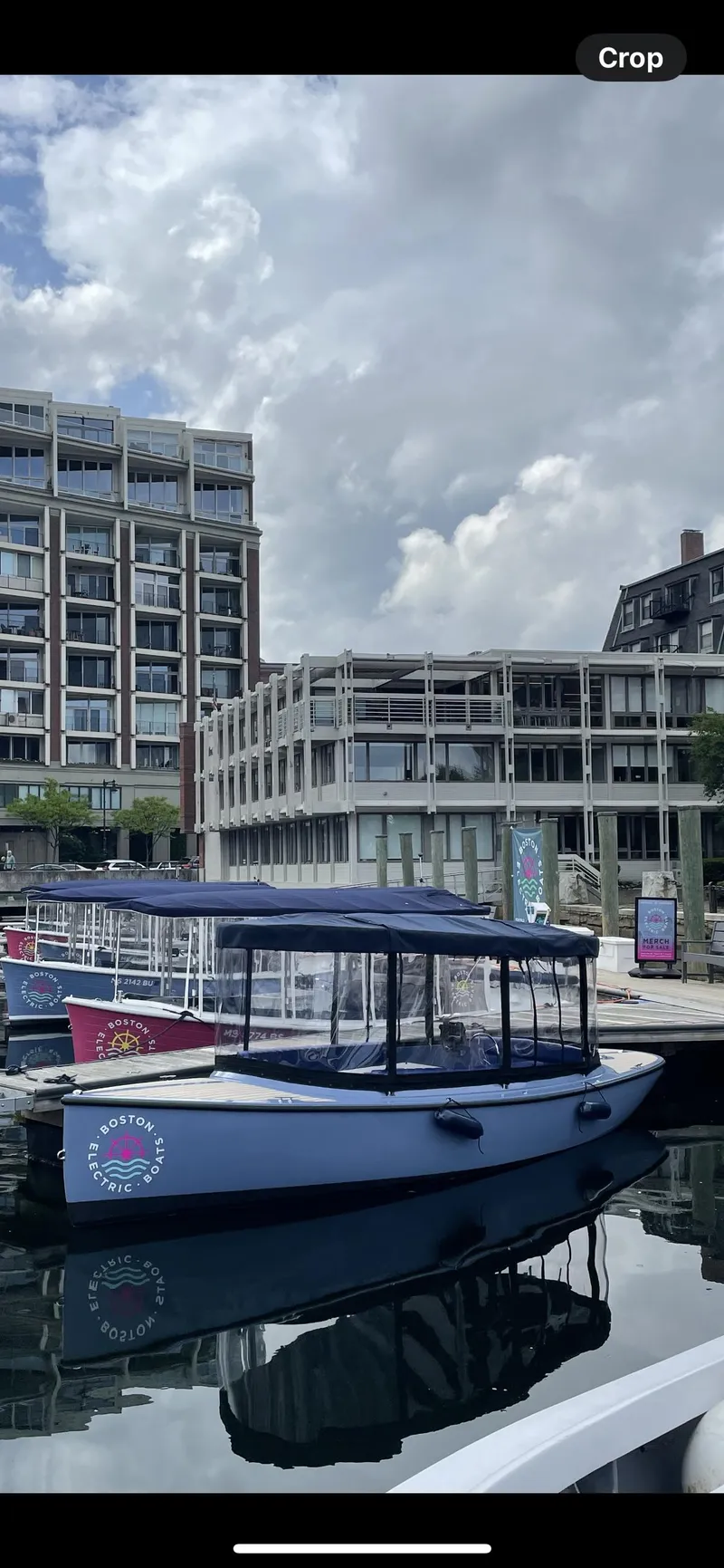 Slide: The Image of 2024 Vision Marine Technologies Fantail 217 boat docked in urban marina setting. - 2