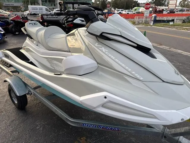 Slide: The Image of 2025 Yamaha Marine Waverunner VX Cruiser HO with audio, pearl/mint, parked with other jet skis. - 6
