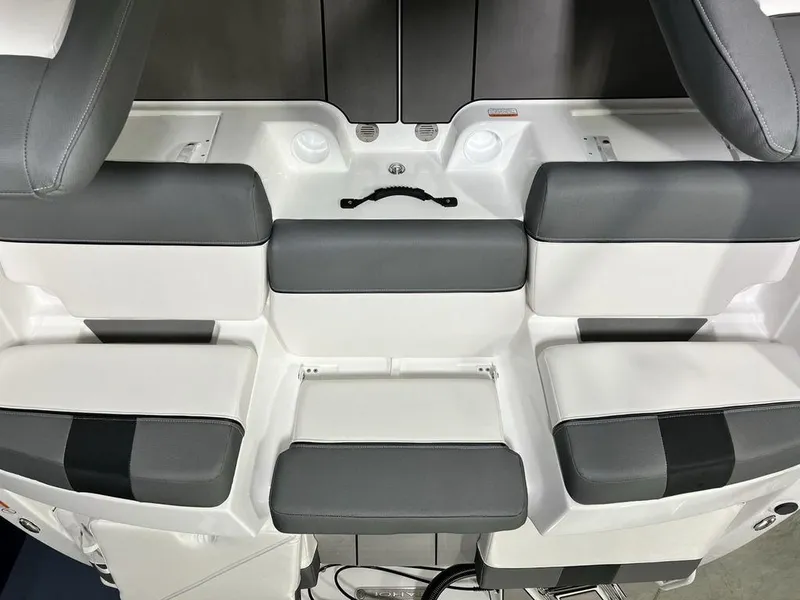 Slide: The Image of 2025 Tahoe T21 boat seating area with gray and white cushioned seats. - 16