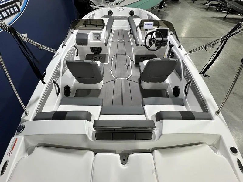 Slide: The Image of 2025 Tahoe T21 boat interior with modern seating and steering console. - 20