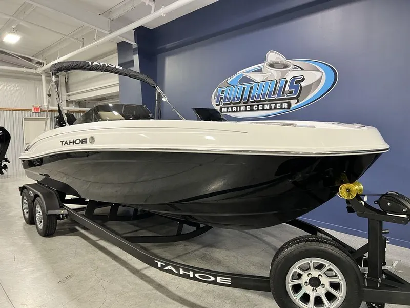 Slide: The Image of 2025 Tahoe T21 boat on trailer at Foothills Marine Center showroom. - 3