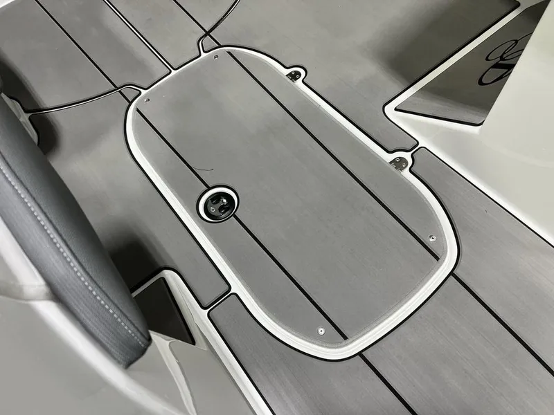 Slide: The Image of 2025 Tahoe T21 boat deck with sleek, modern design and storage compartment. - 7